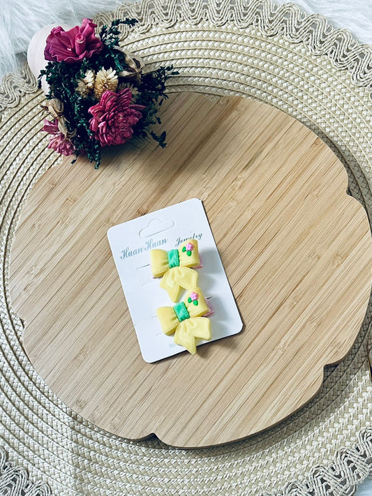 92 - Duo barrettes noeud jaune